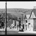 Street in the important anthracit town of Coaldale, Pa., showing huge coal bank in background.